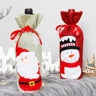 China Party Decration New Arrival Christmas Decorations Burlap Red Wine Bottle Cover Christmas Restaurant Party Decorations for sale