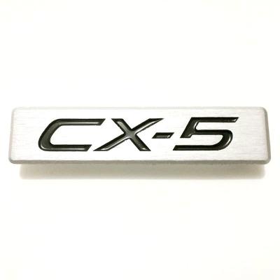 China Custom Aluminum Europe Badge Mazda CX-5 Autofoot Protection Badge for sale