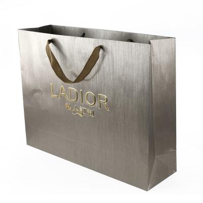 China Recyclable Custom Texture Garment Bag Specialty Haosen Gold Stamping Paper Bag for sale