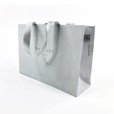 China Texture Specialty Paper Bag Recyclable Embossing Silver Stamping Paper Shopping Bag for sale