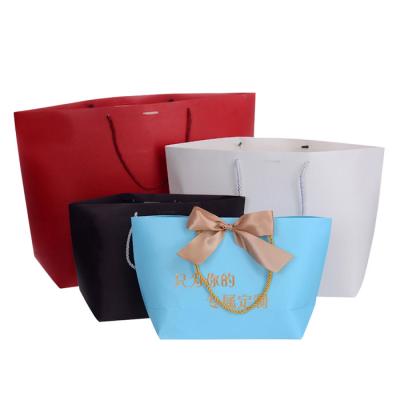 China Recyclable Custom Large Size Clothes Paper Bag Packaging Handle Paper Bags Kraft Paper Gift Bag With Handles for sale