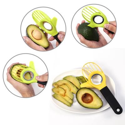 China Viable Kitchen Instruments 3 in 1 Avocado Cutter Knife Hollow Puncher Plastic Avocado Slicer In Stock for sale