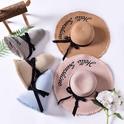 China New Summer Character Women Sun Hat Female Bow Ribbon Foldable Straw Hats With Black Ribbon Soft Beach for sale