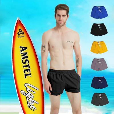 China Breathable Custom Design Quick Dry Mens Beach Shorts Solid Colors Swim Trunks for sale