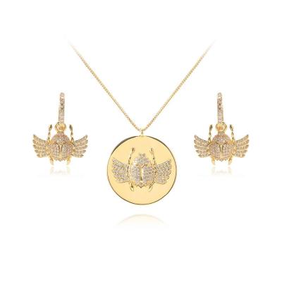 China FASHIONABLE Wuzhou Jewelry Wholesale Price Beetle Sign Hip Hop Jewelry Women Gold Earring Necklace Jewelry Sets LS for sale