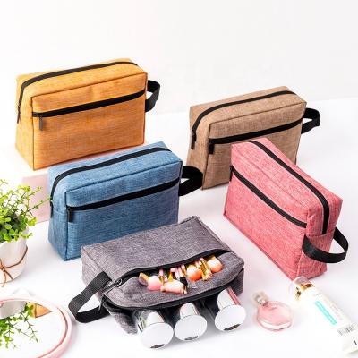 China Fashion Plain Color Portable Makeup Bags for Women Zipper Cosmetic Wholesale Polyester Cosmetic Bag Packaging Bag for sale