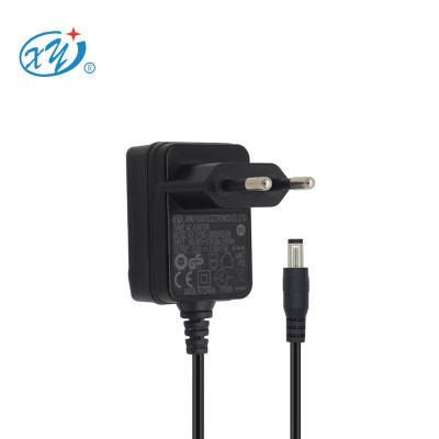 China Ce Gs Ukca Certified Power Adapter Iec61558 Iec62368 Approved Standard Certificates 6w 0.5a 1a 5v 6v 9v 12v 15v DC to AC Adapter XY06J-1200500-EW for sale