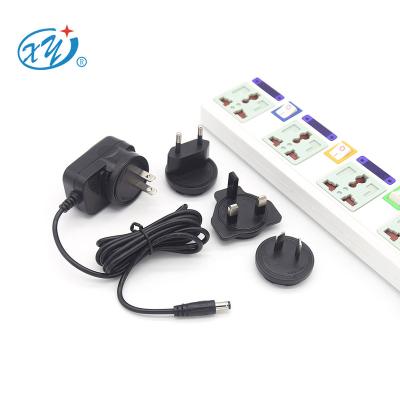 China LED Strip Light Humidifier Set Top Box CCTV Camera Toys International Universal Fan Motor 5v 6v 7.5v 9v 12v 15v 24v Interchangeable Wall Type Plug AC Power Adapter for sale