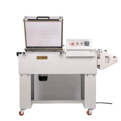 China Food DUOQI FM5540 2 in 1 Automatic Shrink Packaging Machine POF Film Sealer Packer Hand Wrapper for sale