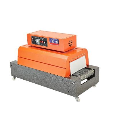 China DUOQI BSX-4030 Automatic Small Food Film Wrapping Machine Hot Shrink Sleeve Packing Machine For Cartons for sale