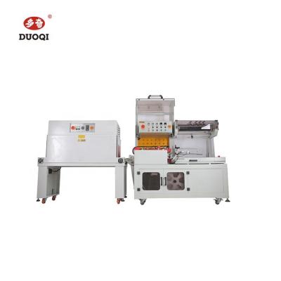 China Food DUOQI DQL-5545+SM4525 L Bar Heat Sealing And Cutting Automatic Shrink Paper Sealer Packing Machine for sale