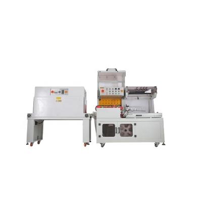 China Food DUOQI DQL-5545+SM4525 L Bar Heat Sealing And Cutting Automatic Shrink Paper Sealer Packing Machine for sale