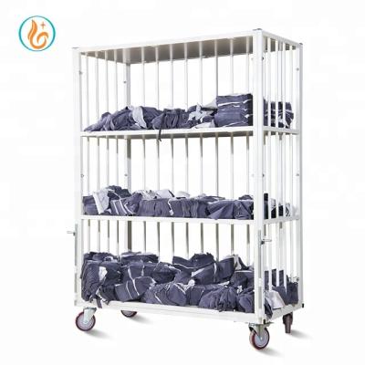 China Easy Movable Three-Layer Four Shelf Panels Cut Piece Circular Tube Trolley For Garment Factory for sale