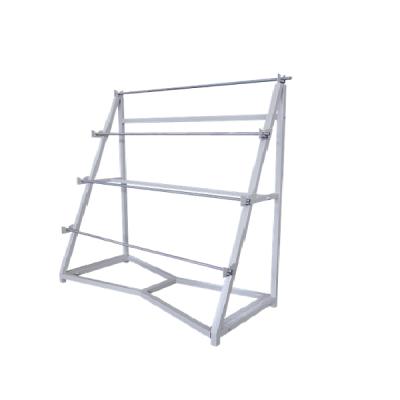 China Square Garment Shops Metal Racks Tube Fabric Roll Textile Display Rack Clothing Machinery for sale