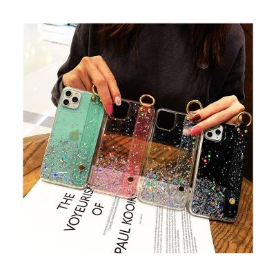 China OEM ODM Glitter Sparkle Shockproof Rope Strap Custom Epoxy Transparent Cell Phone Case With Hand Chains for sale