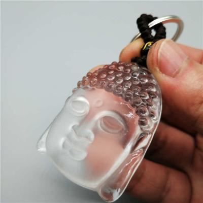 China Buddha Healing White Crystal Head Onyx Energy Buddha Key Chain Protect Your Safety Love Simple Mode for sale