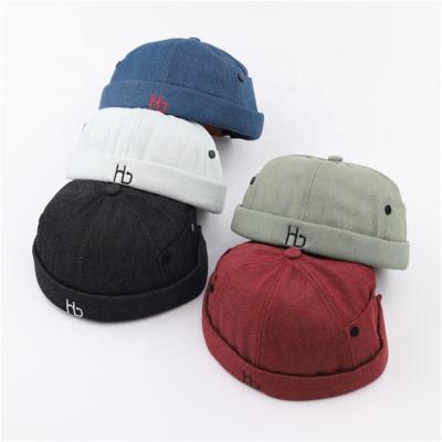 China Custom Embroidery Skull Hat Logo Flat Leather Strap Docker Hat Customized by COMMON for sale