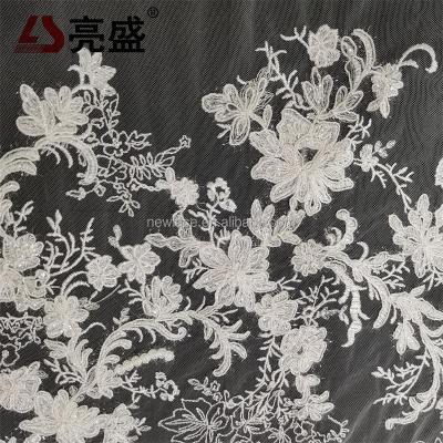 China Sustainable Professional Manufacturer Of Water Soluble Fabric 100%Polyester Embroidery Fabric With Sequin Yarn And Bone Line for sale