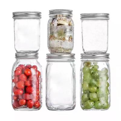 China Stocked Custom Design 16oz 32oz Glass Mason Jar Empty Regular Mouth Food Storage With Metal Lid for sale