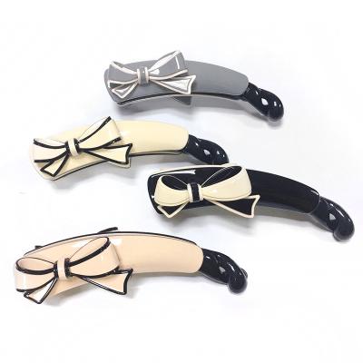 China Creative Korean Hair Stand 2022 New Bow Tie Moon Shape Ponytail Acetate Banana Pink Black Hair Claw Clip for sale