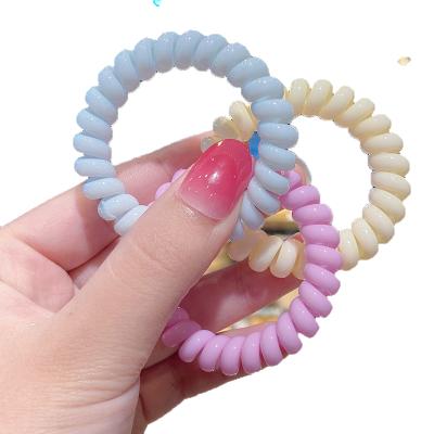 China Wholesale Solid Color Candy Big Elastic Hair Tie Bracelet Tpu Telephone Wiring Elastic Hand Tied Hair Weft Band Men for sale