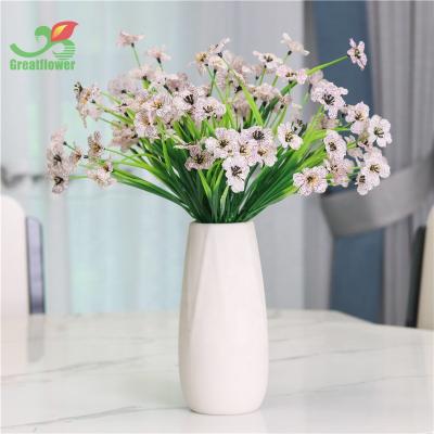 China 5 Fork Spring Grass Orchid Plastic Flower Home Indoor Custom Simulation Artificial Flower Orchids Decoration for sale