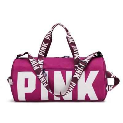 China Fashion Customized Logo Large Capacity Pink Duffle Bags Gym Women Waterproof Sports Travel Bag for sale