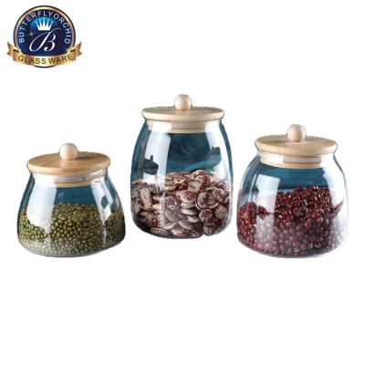 China Freshness Preservation Wholesales Crystal Food Glass Storage Jar With Wooden Lid Food Container Sealed Glass Jar for sale