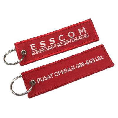 China High Quality Custom Clothes Side Embroidery Fabric Double Key Chain Remove Before Theft Key Chain for sale