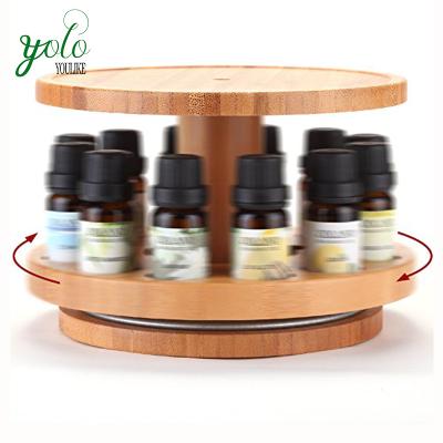 China 2 Tier Sustainable Bamboo Essential Oil Rack With Carousel Top Storage Tray for sale