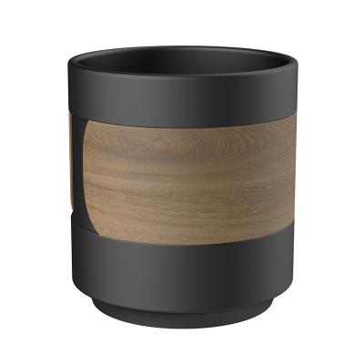 China Sustainable DHPO Mini 150ml New Design Wholesale Matte Black Handleless Nordic Reusable Ceramic Coffee Tea Mug with Unique Wooden Sleeve for sale