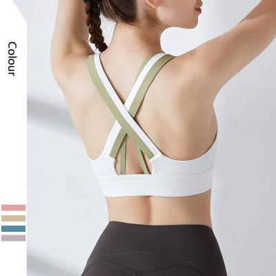 China Breathable Contrasting Color Yoga Sports Bra Women's Back Cross Back Quick-drying Halter Fitness Wear for sale