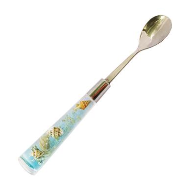 China Viable Stirring Ocean Stainless Acrylic Spoon Handle Blue Seashells Design Cafe Restaurant Kitchen Table Accessories for sale