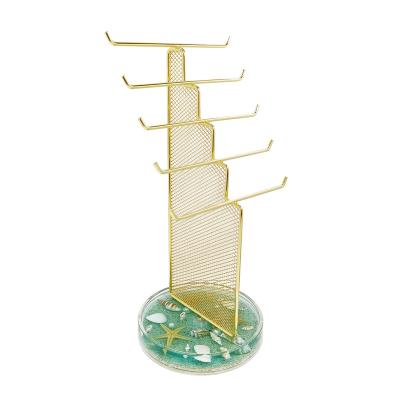 China Metal Stand & Acrylic Mesh Stand Earring Necklace Holder Tray Decorated Seashells Jewelry Stand Gold Acrylic Low Luxury Jewelry Stand for sale