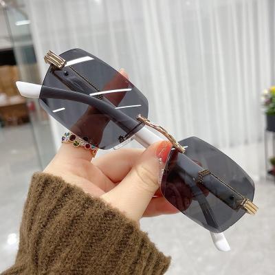 China Fashion Hot Sunglasses 2022 Fashion Wholesale Rimless Party Square Sun Glasses Frameless Sunglasses for Women Girls Men with Pink UV400 Protection for sale