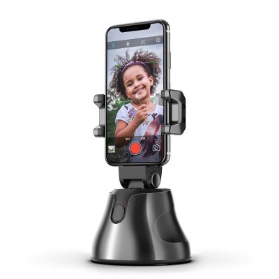 China 360 Degree Rotating 360 Degree Rotating Volg Rechargable Automatic Intelligent Camera Position Tracking AI Face Mobile Phone Holder for sale