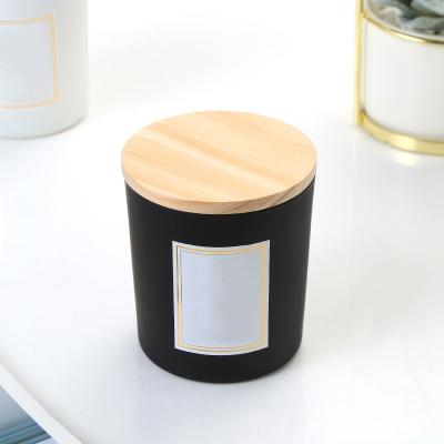 China Wholesale Empty Home Decoration Frosted Round Glass Candle Jars With Wooden Lids Holder Vessels Votive Matte Colored for sale