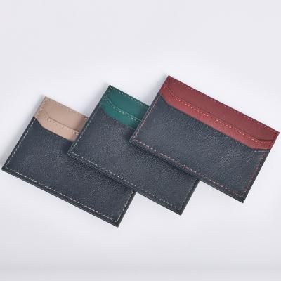 China Ultra Thin Slim Designer GENUINE LEATHER Small RFID Blocking Genuine Leather Credit Card Holder Wallet for sale