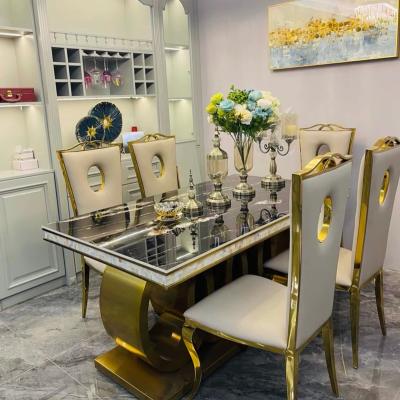 China Modern hot sale popular 10 seater stainless steel gold dining table set for dining room for sale