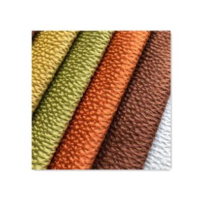 China Sueded 26 Colors 100% Polyester Pressure Brushed Glue Embossed Holland Velvet Upholstery Sofa Pillow Fabric for sale