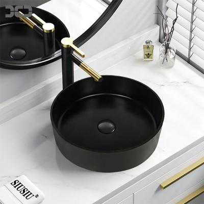 China Modern Bathroom Compound Quarzt Bathroom Sink Black Oval Over Counter Sink Porcelain Wash Hand Basin for sale