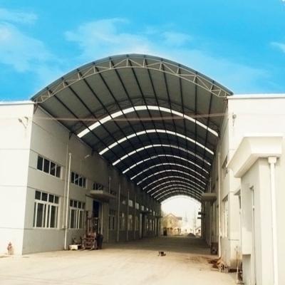 China Steel Fabricated House Prefabricated Steel Truss Frame Arched Roof Curved Arch Building for sale