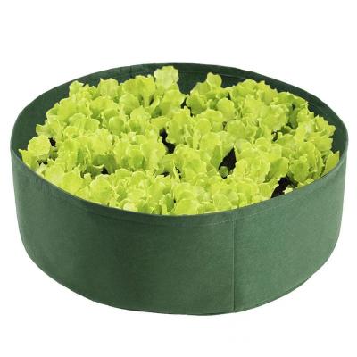 China Plant Fiber Held Planting Vegetable Garden Round Bag Barrel Indoor And Outdoor Planting Nonwoven Nursery Bags Grow Bag for sale