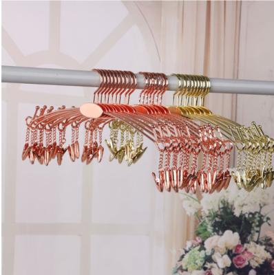 China Salon Rose Gold Metal Lingerie Custom Logo Hangers With Clips for sale