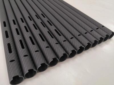 China carbon fiber pipe in carbon fiber fabric  carbon fibre tube with CNC Cutting punching  slotting carbon  rod for sale