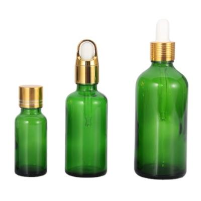 China Non Spill 15ml 20ml 30ml 50ml 100ml Green Essential Oil Glass Bottle With Glass Dropper Aluminum Cap And White Rubber Nipple for sale