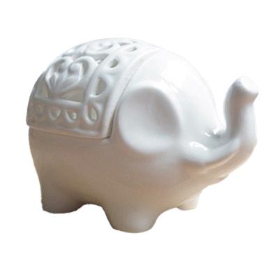 China Nordic style elephant shape creative hot sale home decoration ceramic candle holder hollow candlestick for sale