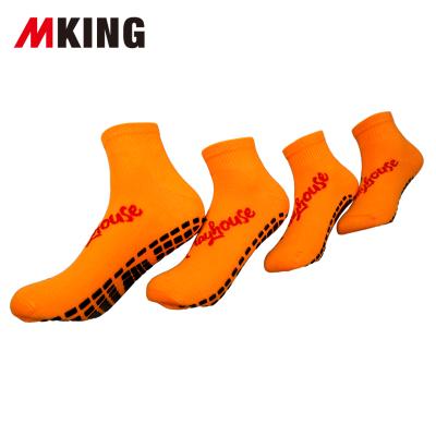 China Disposable Cartoon Logo Orange Color Polyester Trampoline Bangs Dots Child Female Singers Trampoline Socks Antiskid Black for sale