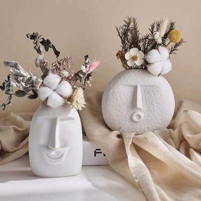 China Nordic Minimalist Fashionable Home Minimalist Vase White Ceramic Dry Flower Face White Vase For Home Decor for sale