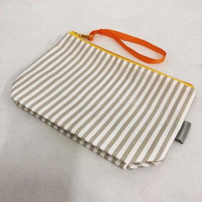 China Non Woven Striped Recyclable Custom Small With Zipper Cosmetic Pouch Women's Lamination Bag Toiletry Bag Travel Bag for sale